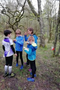 children with maps in wood